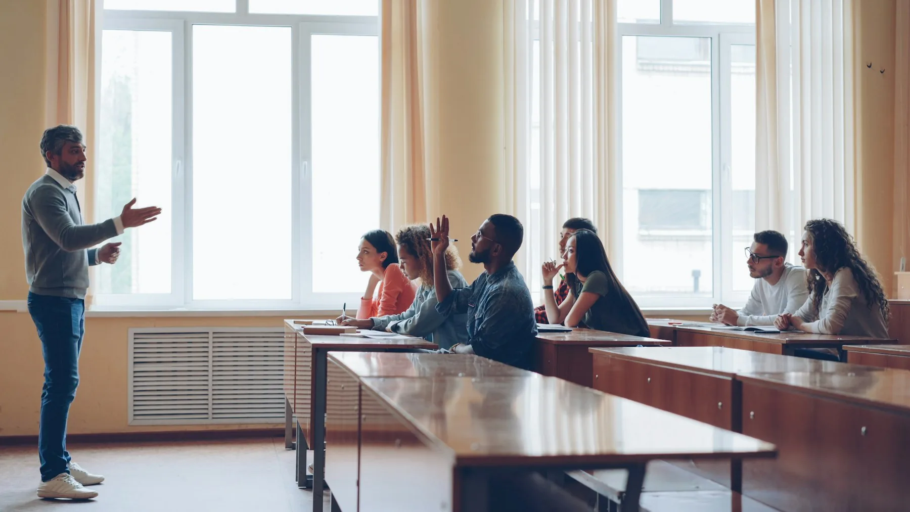 Teacher leading a university classroom discussion
